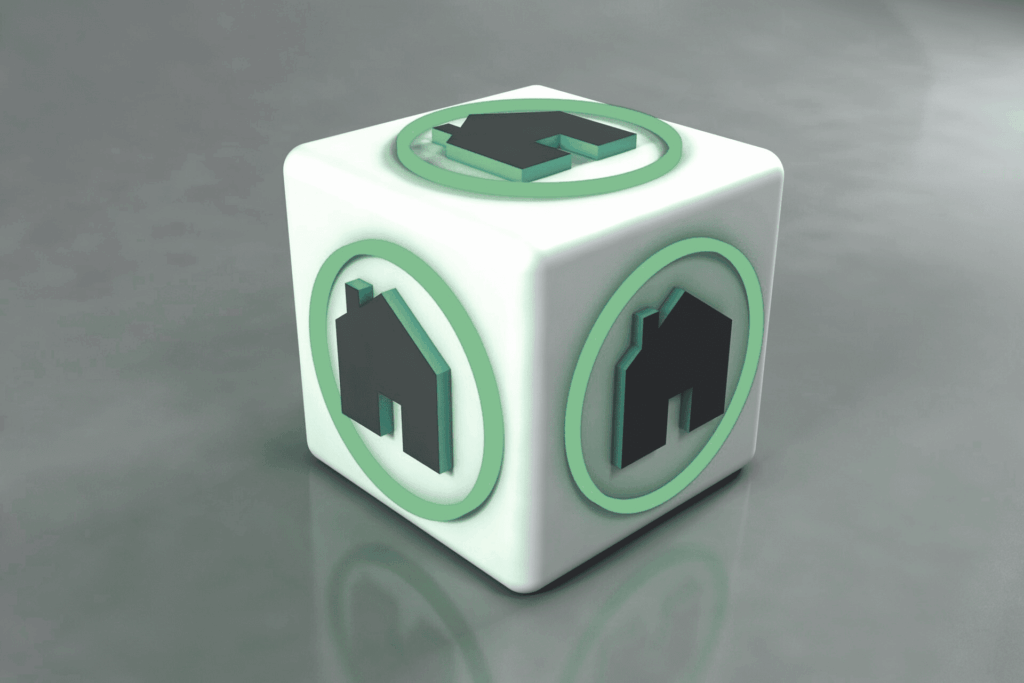 dès à 3 faces. chaque face comporte le symbole d'une maison. Symbolisant les opérations de marchand de biens.